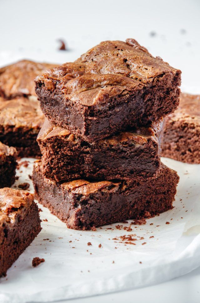 A plate filled with brownies, the brownies look so good i could eat them all