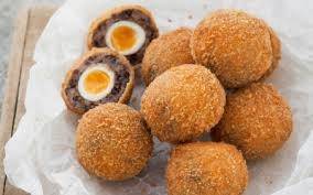 a plate of Scotch eggs