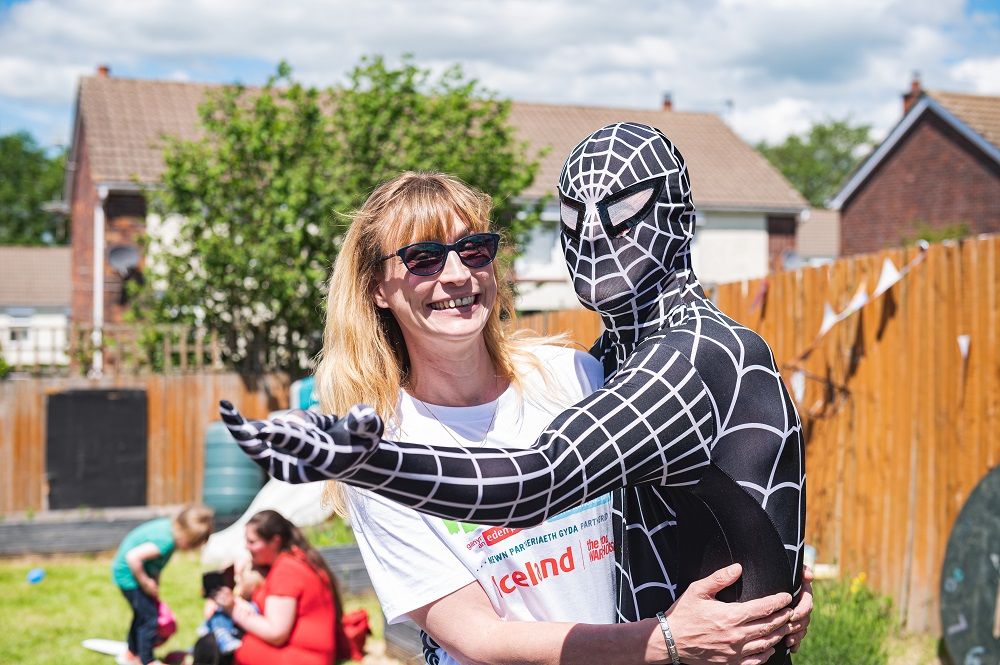 A woman and a person dressed up as spiderman 