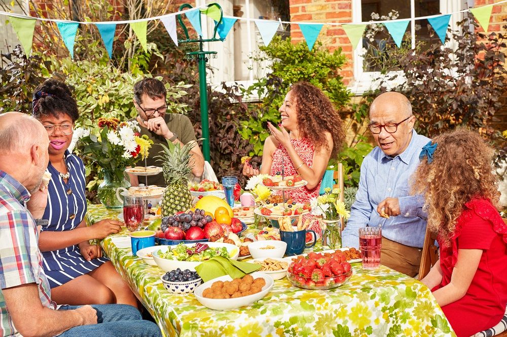 Group of people having a garden lunch party