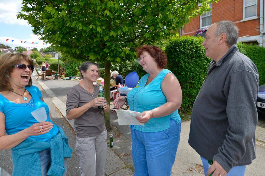 A group of people chatting in the street