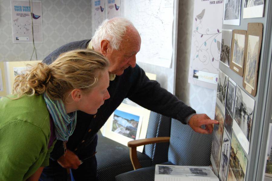 Elderly looking at old photos