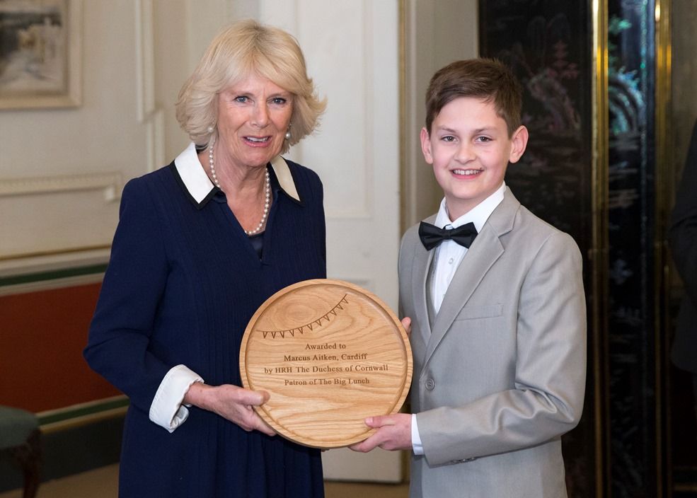 Duchess of Cornwall giving award to Marcus Aitken