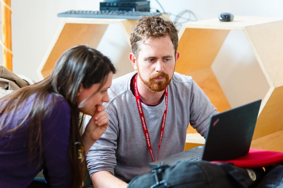 Man and woman looking at laptop