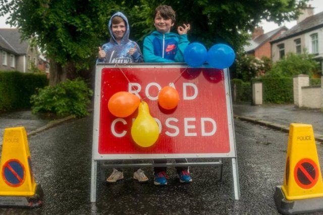 Two young boys with water bombs