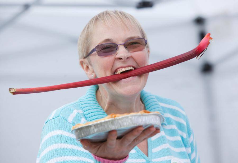 Woman holding up pie