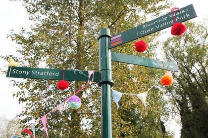 Signpost with bobbles hanging