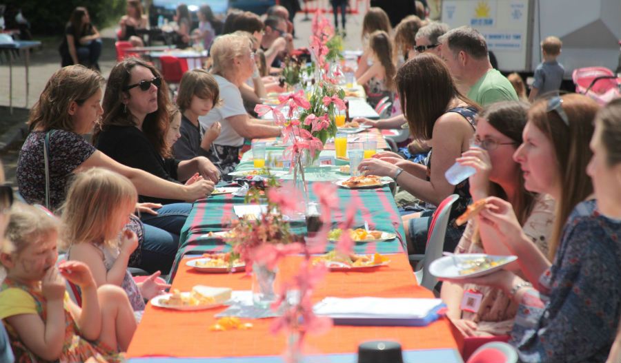 Long table with people having lunch