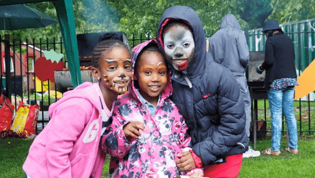 Three kids with their face painted