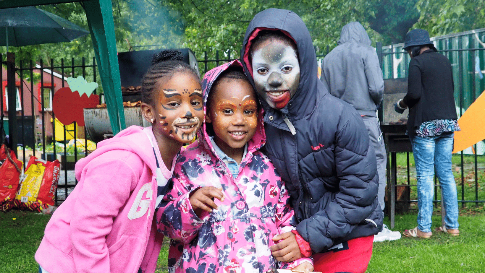 Three kids with their face painted