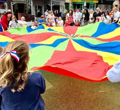 Children playing with a parachute