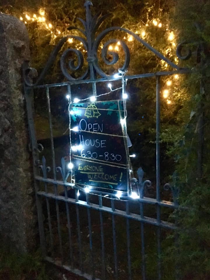 Sign titled 'Open House' on gate