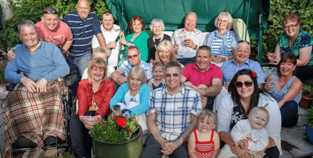 Group of neighbours outside in a garden