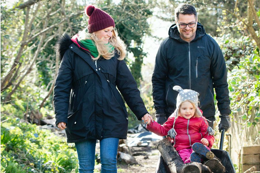 Family walking through forest