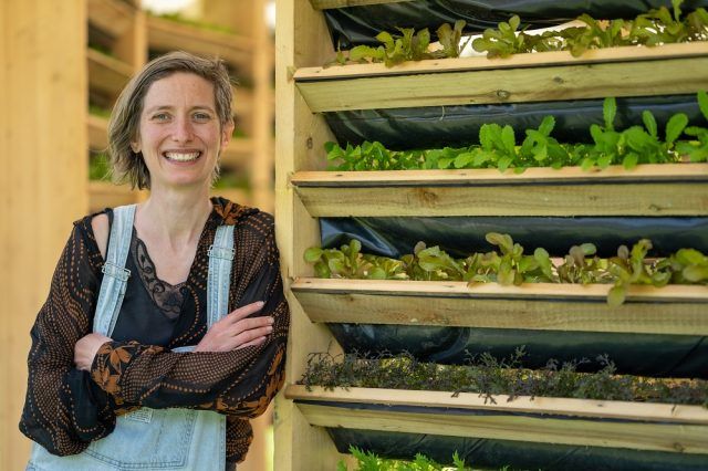 Woman next to plants