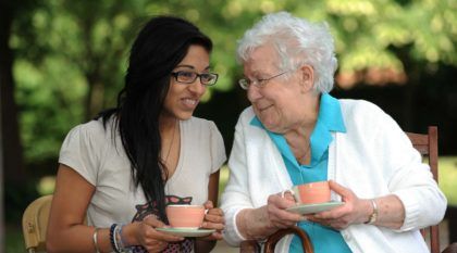 Two woman talking having a cup of tea