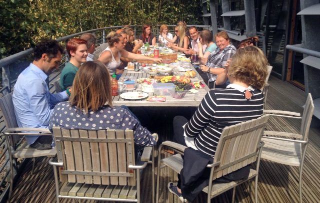 Group of people on a deck having lunch