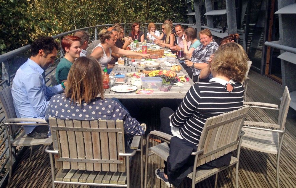 Group of people on a deck having lunch