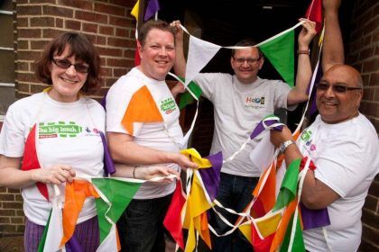 Group of people holding bunting