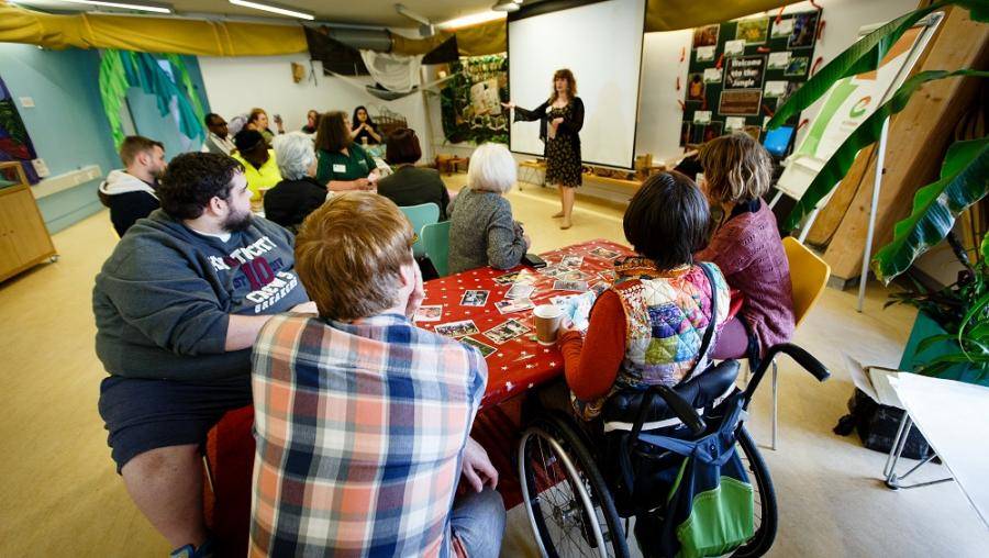 Woman presenting to a group of people