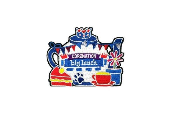 Pawprint fabric badge to commemorate The Coronation Big Lunch - shows a teapot with cake and tea and a plant pot