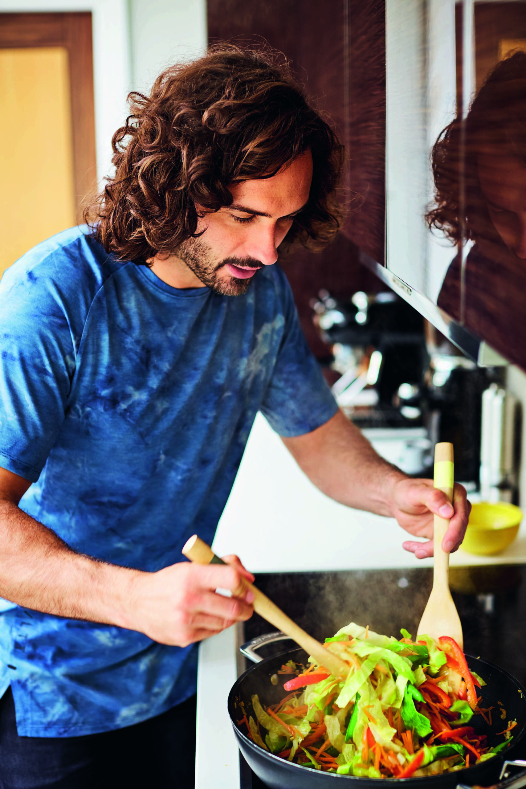 Joe Wicks cooking in a wok