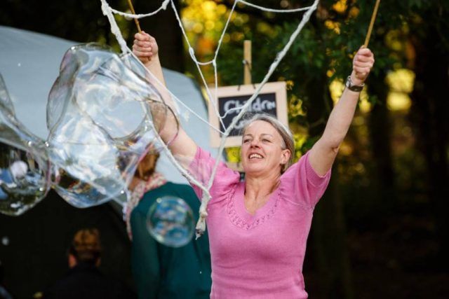 Woman making a giant bubble