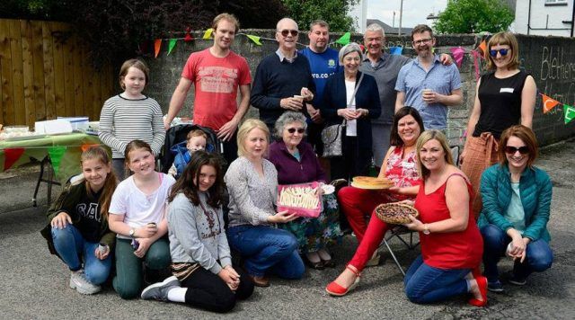 Joanne's Belfast Big Lunch showing a group of adults and children posing for a photo