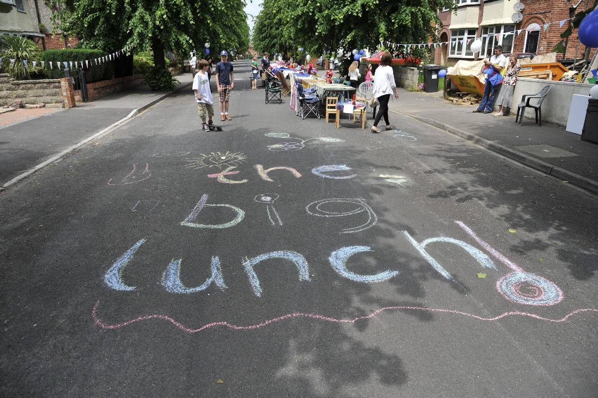 Chalk on the road spelling out 'The Big Lunch'