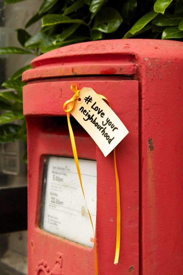 Postbox with tag saying 'Love your neighbourhood'