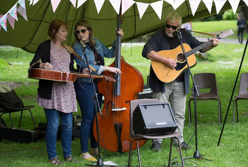 Band playing in marquee with bunting