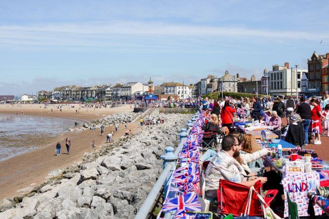 Tables along the seafront adorned with Union Jacks in Morecambe Bay, Lancashire