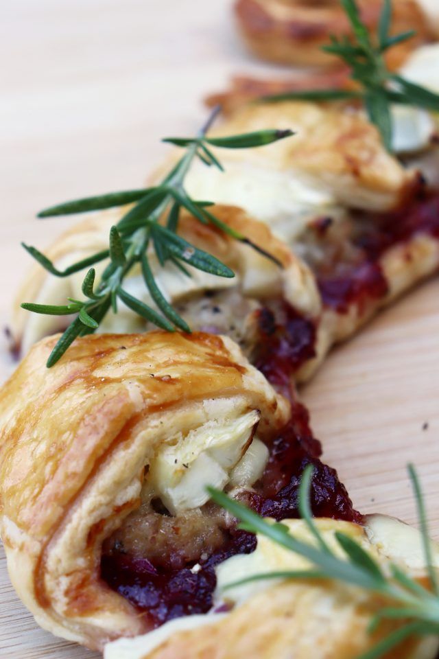 Brie, stuffing and cranberry wreath up close with rosemary on top.
