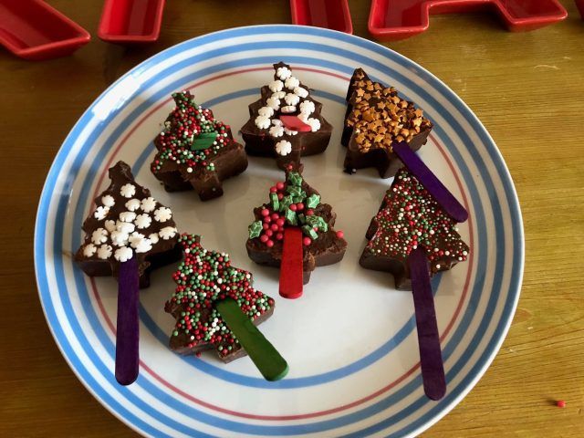 Hot chocolate sticks with festive toppings