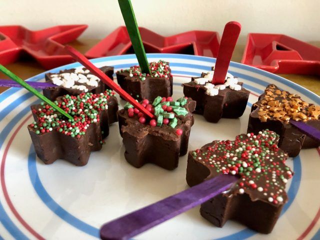 Hot chocolate sticks in tree shapes with lollipop shapes poking out