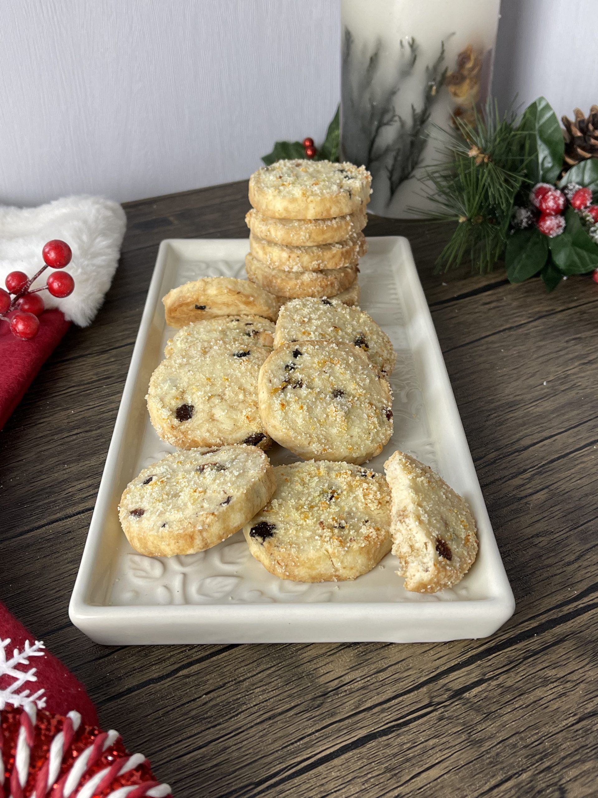 Mince pie shortbread rounds piled on a festive plate