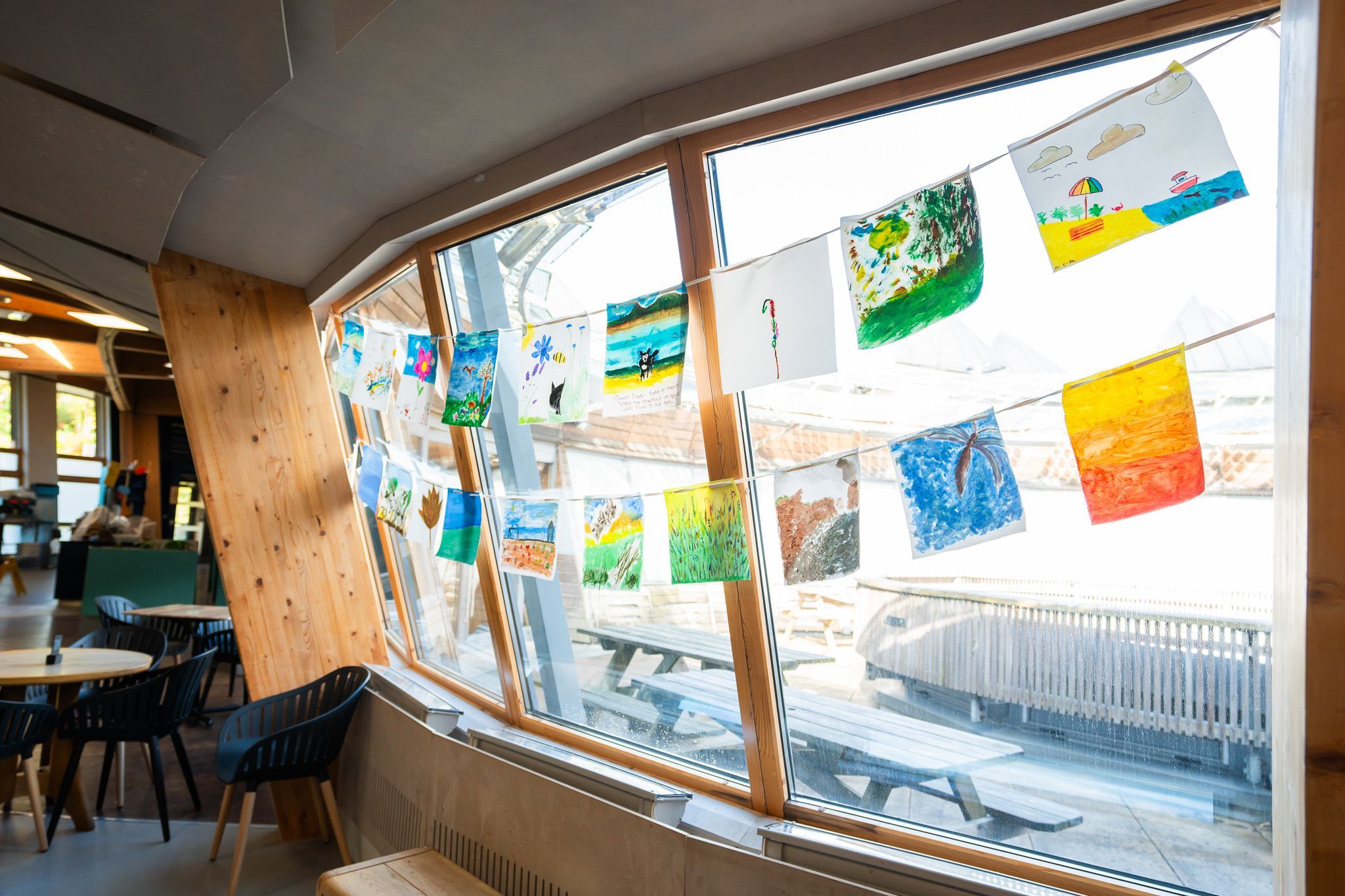 Colourful bunting hanging up against a window