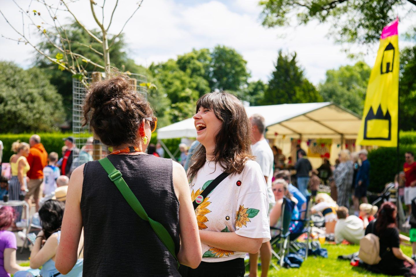 Two women laughing together at a community Big Lunch