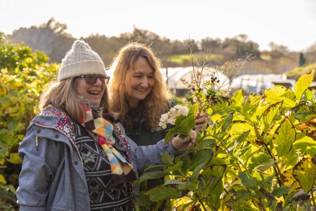 Two women looking at plants at the Eden Project
