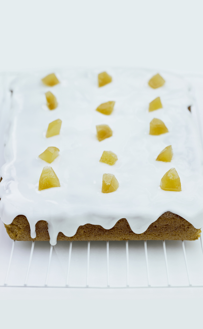Delia's iced ginger cake - a square traybake with small pieces of ginger on top